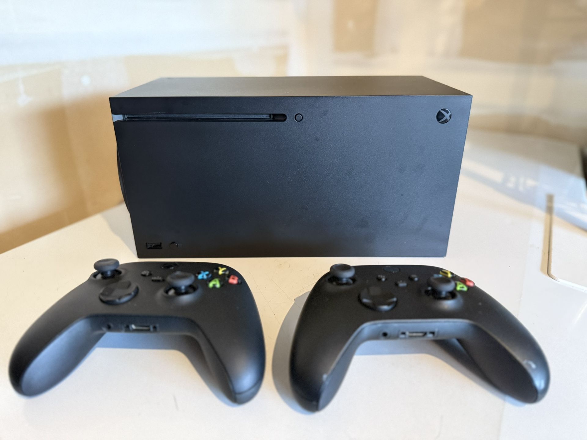 Xbox Series X Black 1TB SSD W/two Controllers, One Brand New Elite series 2 Controller, and 2 games