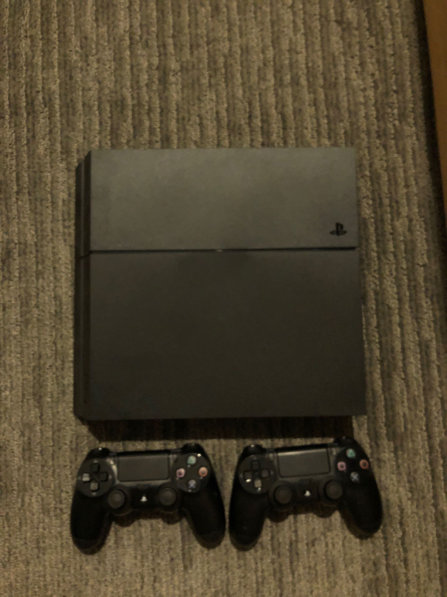 PlayStation 4 with 2 controllers and 3 games