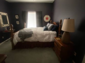 Beautiful, solid oak bedroom set triple dresser with mirror queen bed with bed posts, and nightstand