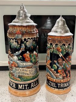 2 VINTAGE GERMAN BEER STEIN MUG HAND PAINTED ANTIQUE "IN DURST'GER MIT ALL SORGEN" 11”H & 10”H