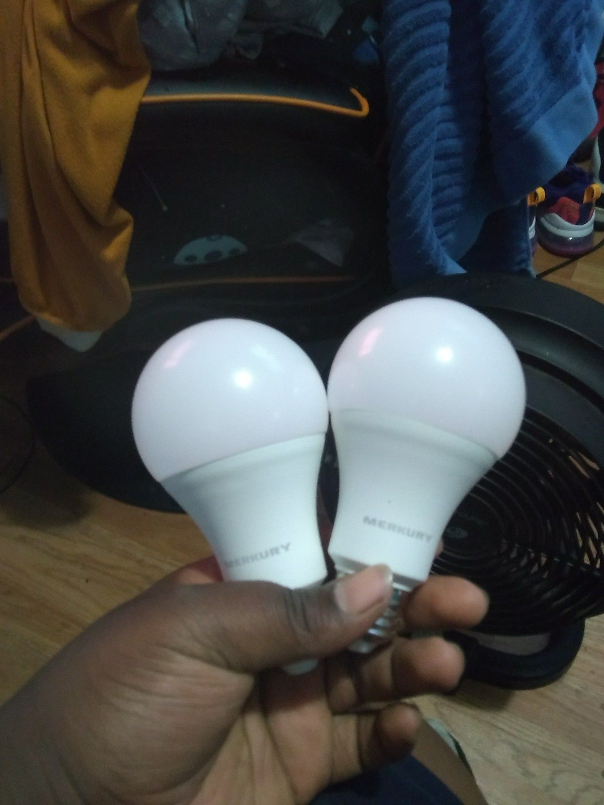 Two merkury LED light bulbs