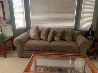 Couch and three coffee tables and two lamps