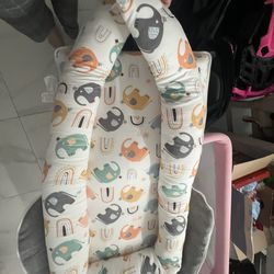 portable infant baby lounger or nest, featuring an elephant and rainbow pattern