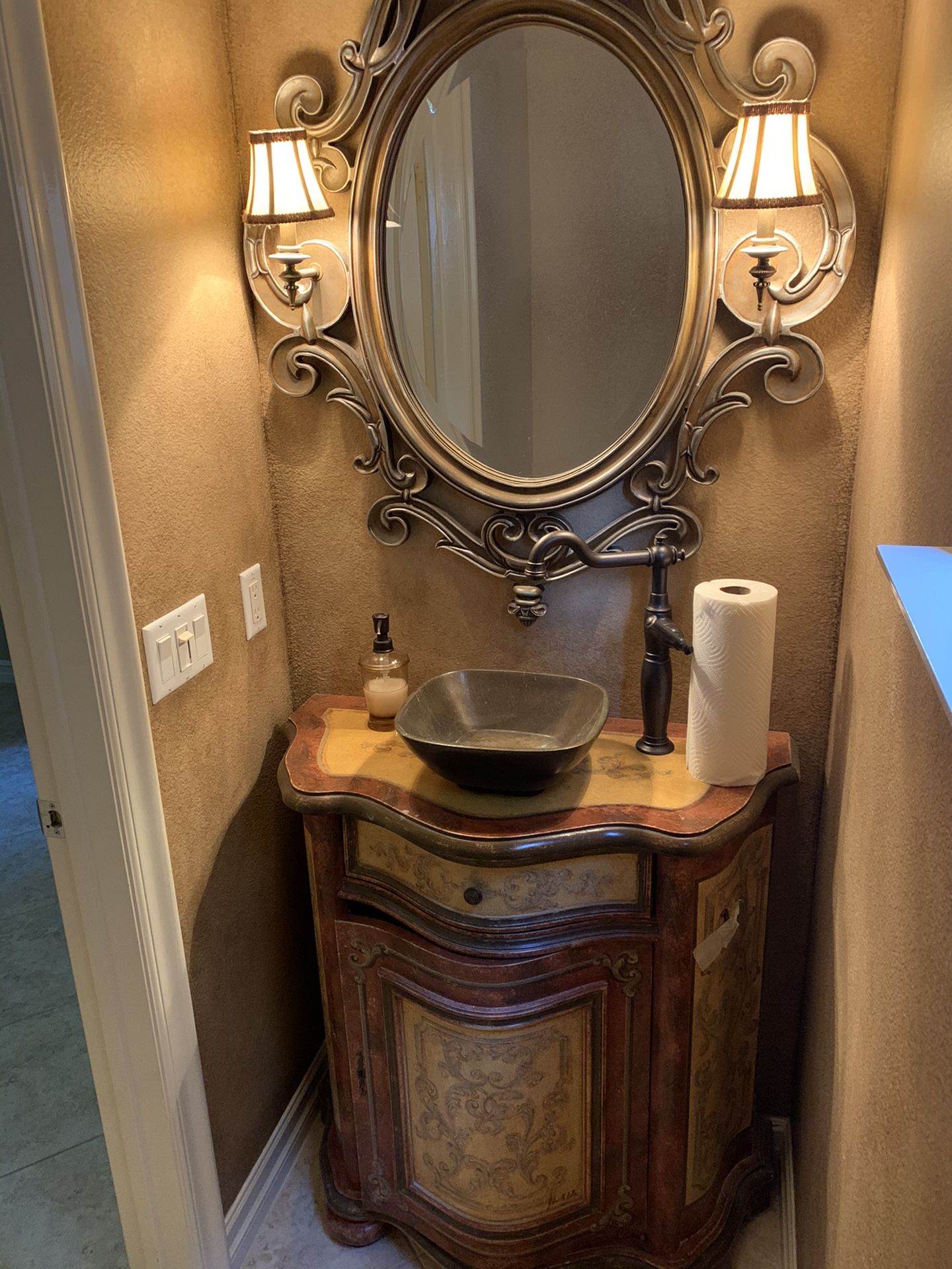 Mirror with attached light sconces