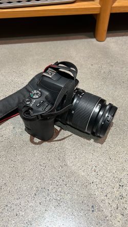 Canon rebel SL2 with a 18-55mm kit lens & two extra batteries
