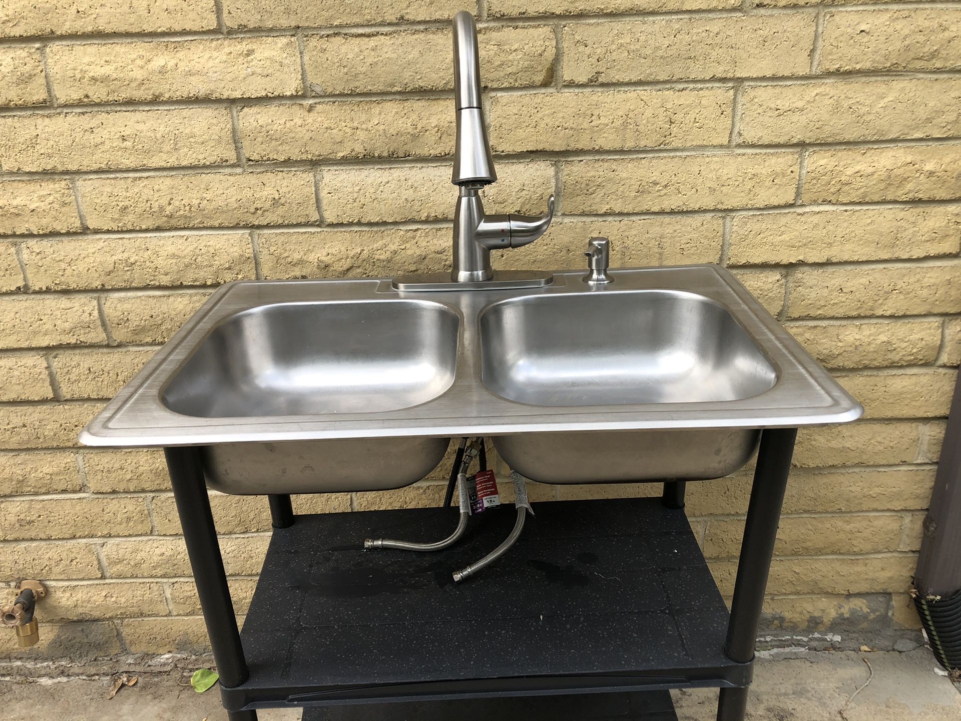 Glacier Bay stainless kitchen sink with faucet