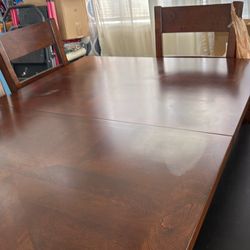 Has a hidden divider Kitchen table with four chairs and one bench