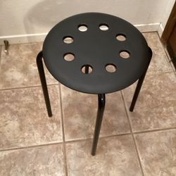 Four Black Plastic Bar Stools with Legs