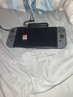 Nintendo Switch with Gray Joy-Cons with  Mario cart
