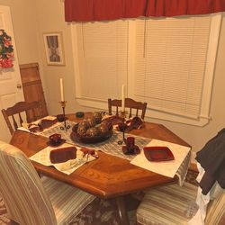 Wooden kitchen table with four chairs