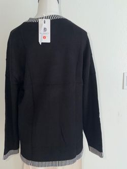 Black long sleeve pullover sweater.  Size M