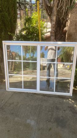 White Vinyl Sliding Window with Grid
