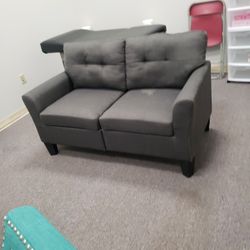 Nice grey colored loveseat $95. Needs cleaning due to being in storage.