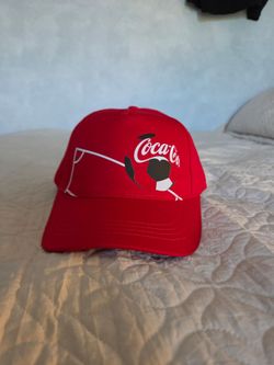 Coca-Cola FIFA 2026 World Cup promotional hat featuring a graphic of a soccer