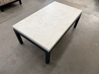 Stone coffee table with black metal frame