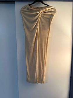 Gold long skirt with a slit on the side