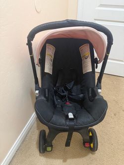 Pink doona stroller car seat