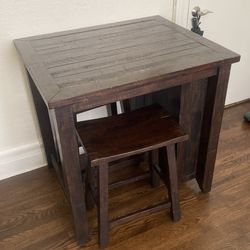 Table with Matching Barstools and Built-in Bookshelf