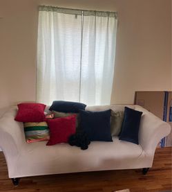 Blue couch and multiple pillows