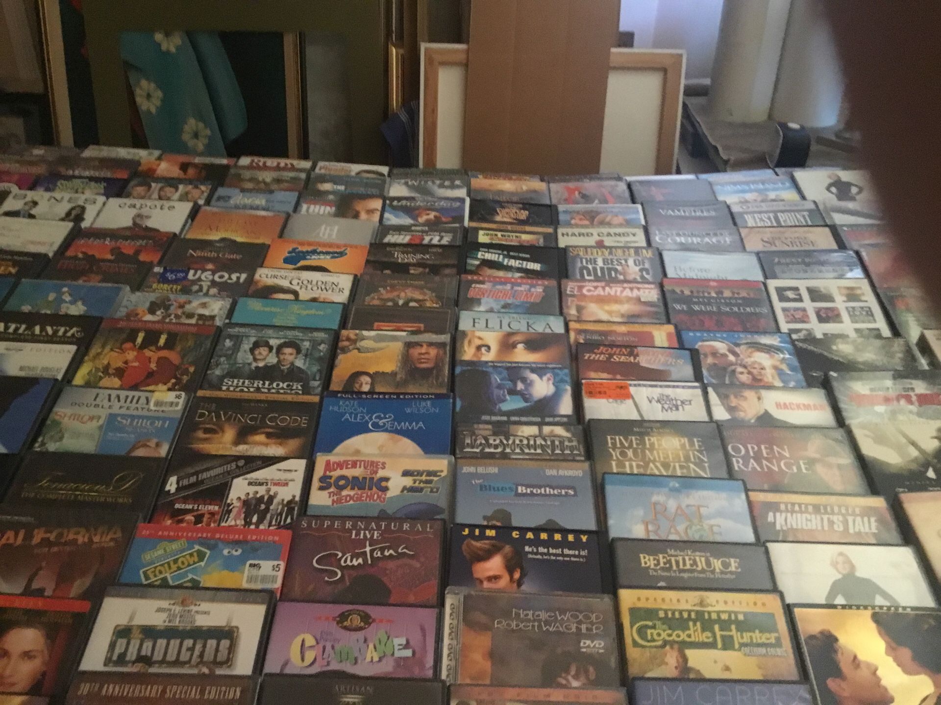 200 DVDs,all have cases,no scratches, ALL KINDS OF MOVIES,SOME SEASONS a little bit of everything