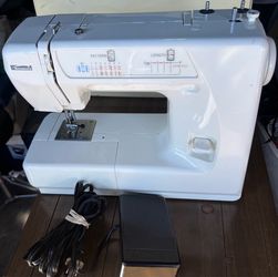 Fully serviced white Kenmore sewing machine made by Janome