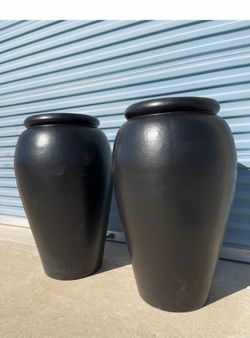 Taller white pots 32” tall made of clay $125 ea