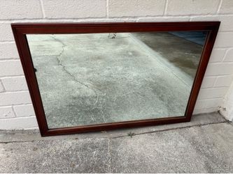 Vintage traditional mahogany wall mirror featuring a gold-gilded, beaded inner trim