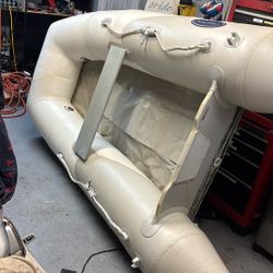 West Marine 8’ Dingy W/ 2 Pumps , Oars, & Carry Case 