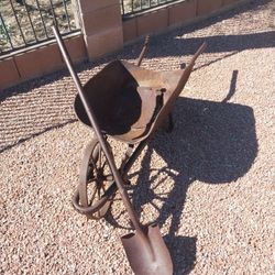 Antique Wheelbarrow And Shovel