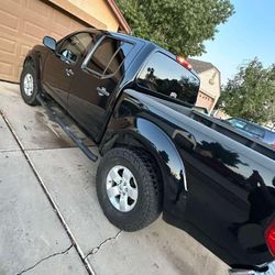Nissan frontier 2012
170 millas