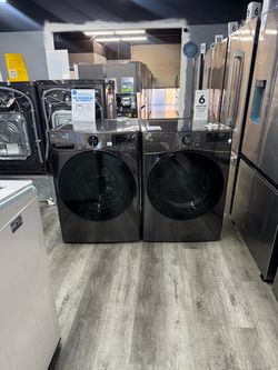 LG 4.5 Cu Ft Stackable Front Load Washer With Steam & 7.4 Cu Ft Stackable Gas Dryer Laundry Set - Black Steel 🔥