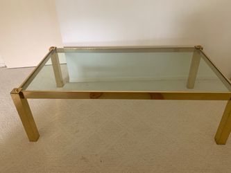 Brass/glass high end table 54 inches by 30 inches by 20 inches high Bought in Bloomingdales.