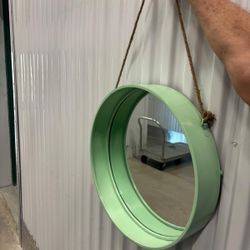 Round mirror, teal in color 18” diameter. .. ready to hang ..$40