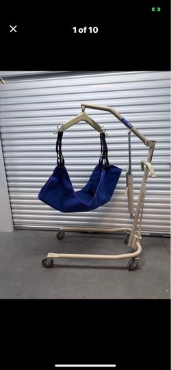 Portable patient lift and sling