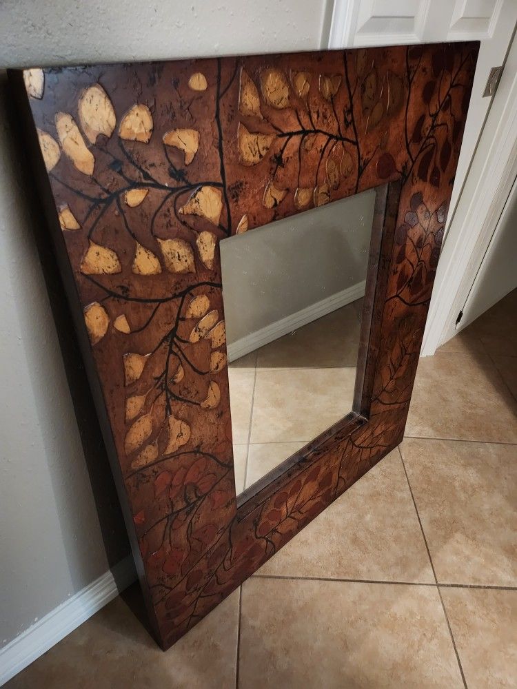 wall Mirror in frame. Colots- brown, red, bronze, gold, black. 34" x 40" x 1 1/2"