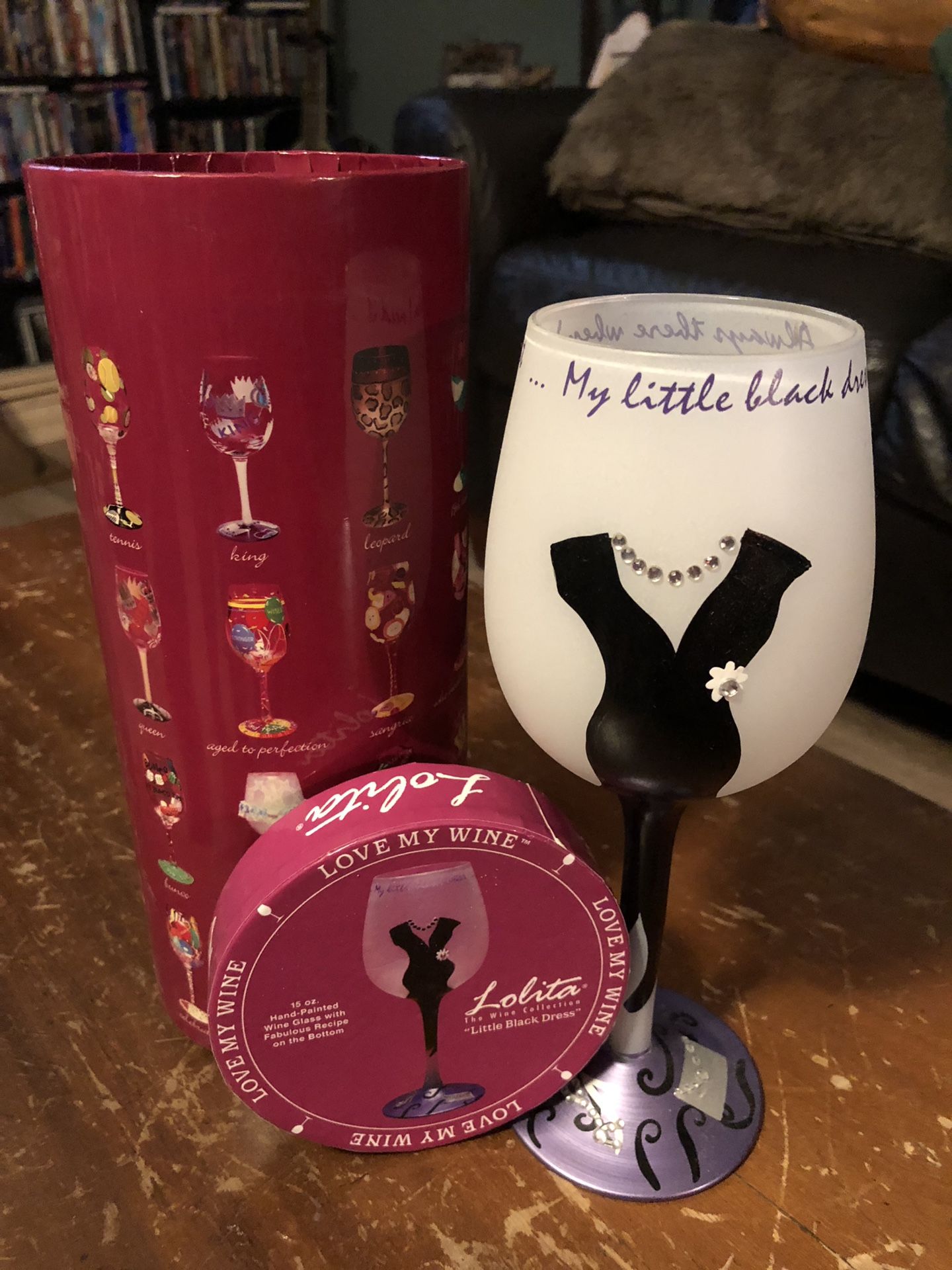 “Little Black Dress” hand painted wine glass. Cute for a party or to use for some fun at home. Comes in sturdy, decorated container for safe storage