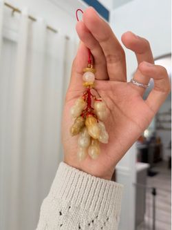 Natural yellow jade carved into peanut shape ornament charm