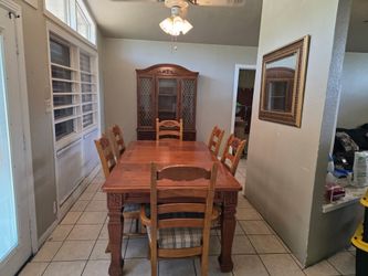 Dining Room Set Solid Table, Chairs and Cabinet ok want it gone 500 for both firm