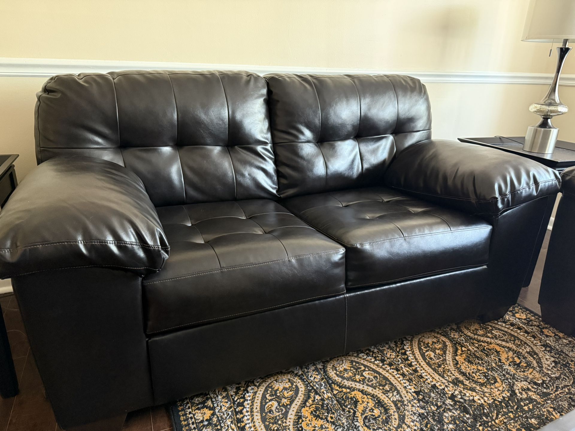 Ashley’s Furniture Dark Brown Leather Love Seat Model #:S(contact info removed)01