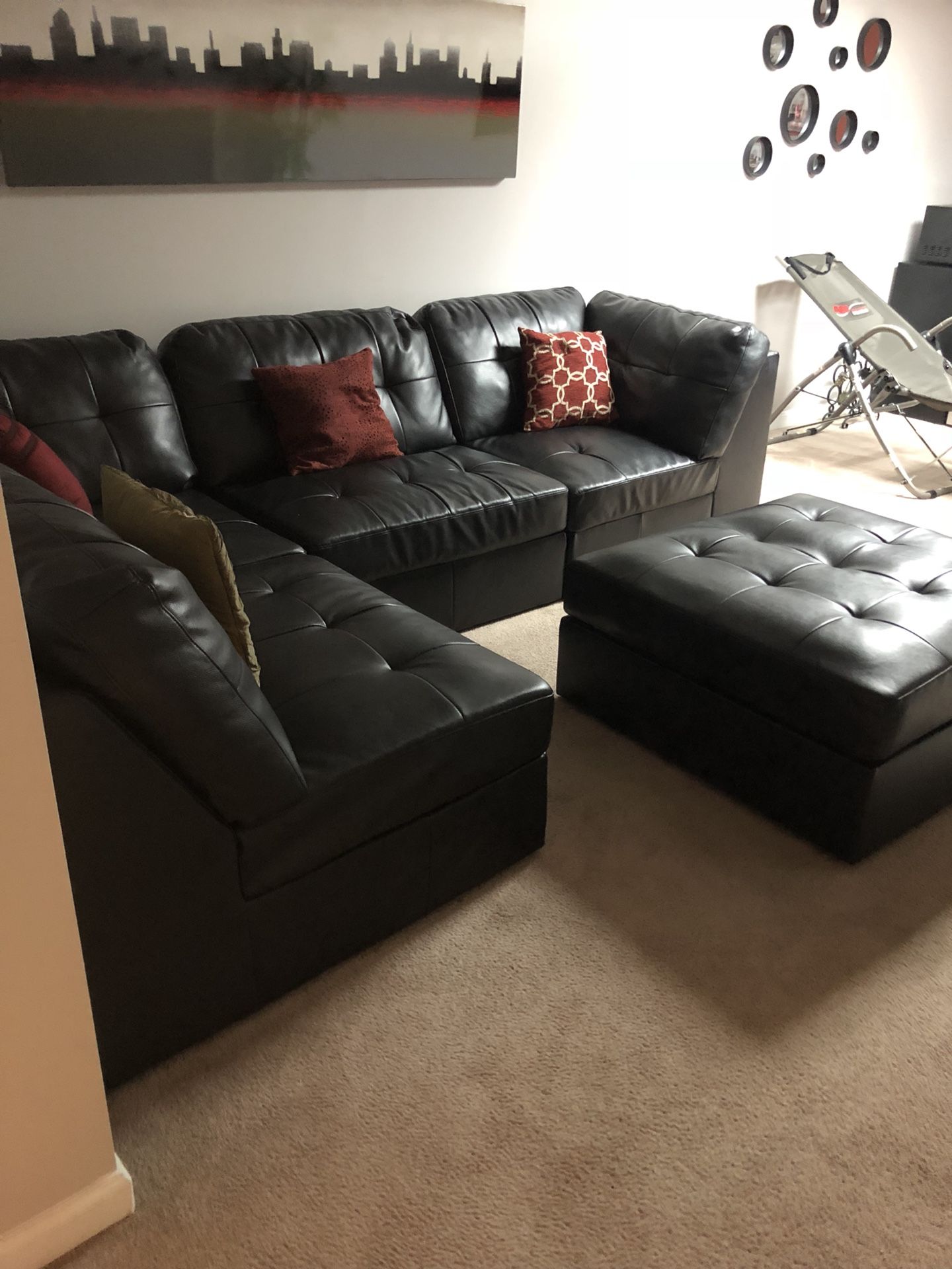 Black leather L-shaped sectional w/ ottoman