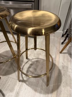 4  gold metal Island stools