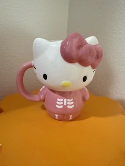 PINK HELLO KITTY DRESSED AS A SKELETON MUG