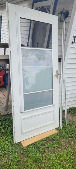 Exterior Storm door with screens and sliding frosted windows