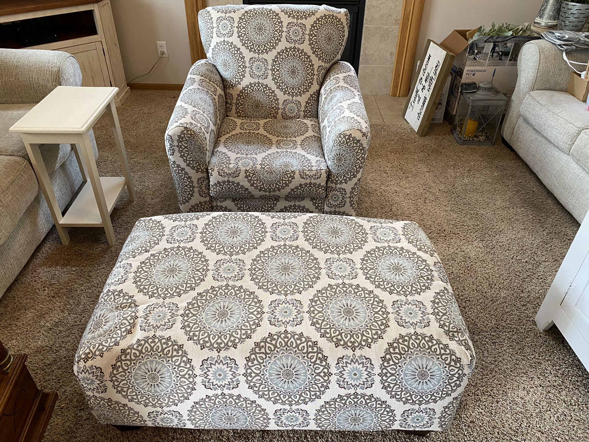 Accent chair with ottoman and accent pillows