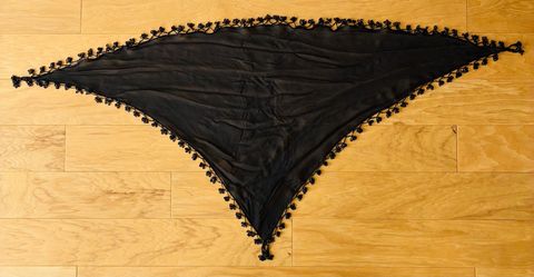 Black beaded shawl/wrap. 54” wide, 28” high at center.