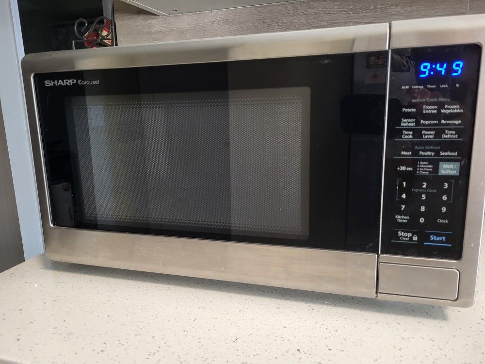 Sharp 1.4cu Countertop Microwave Model SMC1442CS