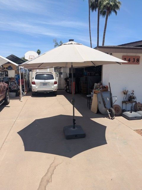 (2)10' Wide Solar/Tilting Umbrellas with HD 80lb. Bases