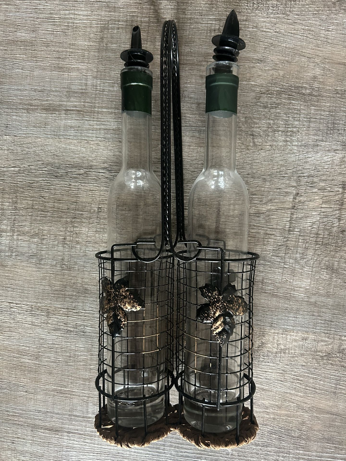 Two Glass Cruets With Decorative Metal Caddy
