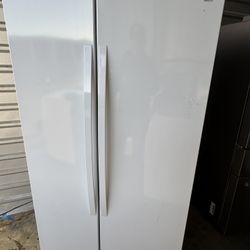 Kenmore side-by-side white refrigerator with a smooth finish. No water or ice maker. Dimensions: 68 7/8” height, 35 7/8” width, 32” depth. Excellent w