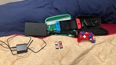 Nintendo switch with accessories and games